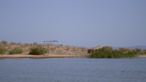 abandoned yurt by lake