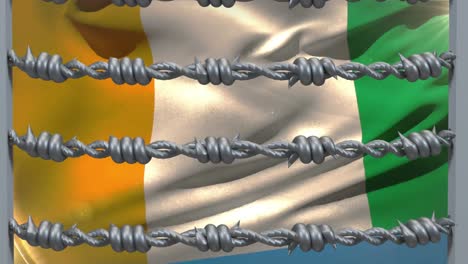 barbed wires against ivory coast flag