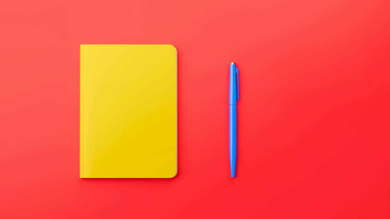 Yellow Notebook Blue Pen On Red Background Overhead Flat Lay With Vibrant Minimal Workspace Feel, Journal