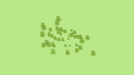 animation of multiple moving clover over green background