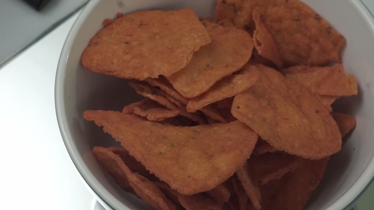 Close-up of snacks being poured into a bowl