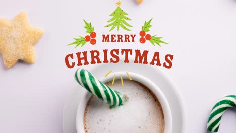 animación de saludos de navidad texto sobre decoraciones de navidad y caña de caramelo con chocolate caliente.