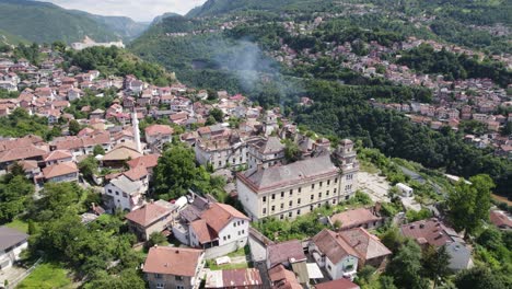 aerial: jajce kasarna, sarajevo, nestled amid green hills