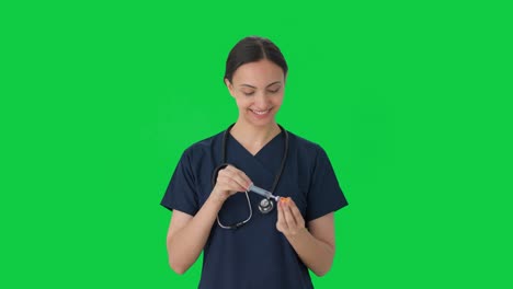 Happy-Indian-female-doctor-giving-vaccine-Green-screen