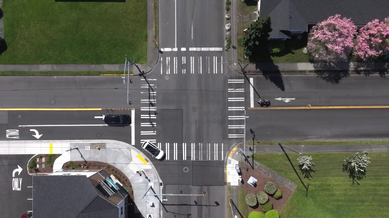 Top Down View Of A Signalized Urban Intersection In Puyallup, Washington, USA - Drone Shot