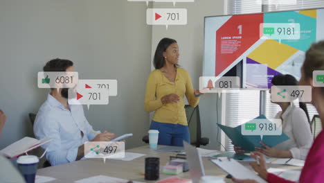 in school, diverse team discussing animation with social media icons overlaying meeting