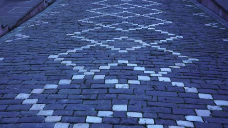 cobblestones with decorative motifs in the alleys of gjirokaster old city in albania