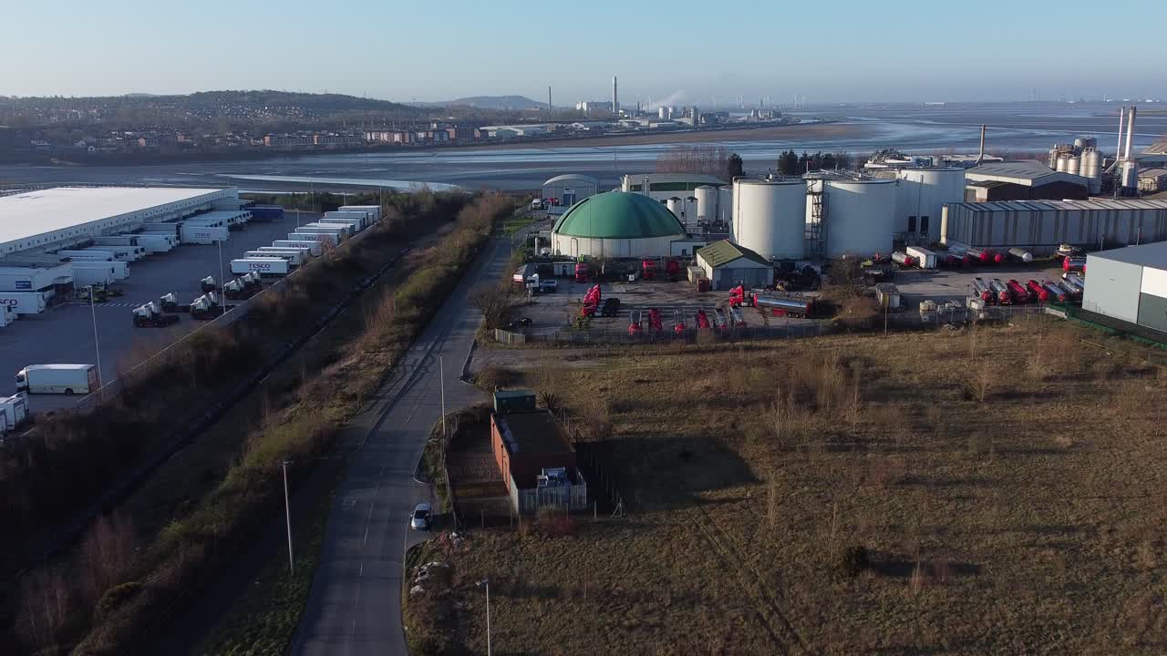 Bio food green fuel agribusiness refinery plant industrial global factory aerial slow push in view descending