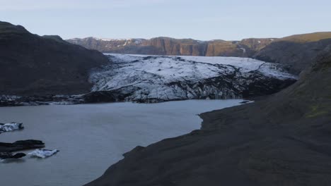 magnificent view of the famous solheimajokull glacier in iceland on a summer afternoon - forward drone shot