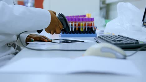 laboratory technician scanning invoices with barcode scanner 4k