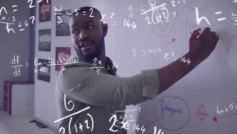 Animation-of-maths-calculations-over-african-american-male-teacher-writing-on-whiteboard