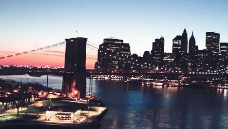 brooklyn bridge and manhattan skyline at dusk from manhattan bridge.