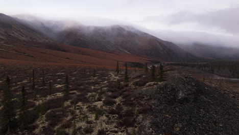 ogilvie mountains on the dempster highway during fall in canada - aerial shot