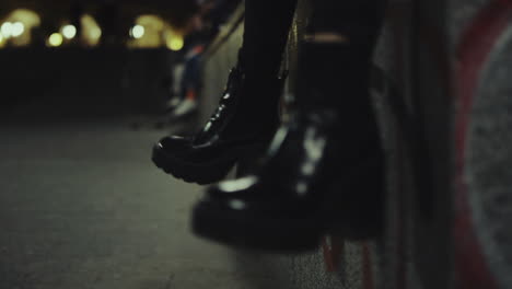 woman shoes legs moving at late night city in urban background.