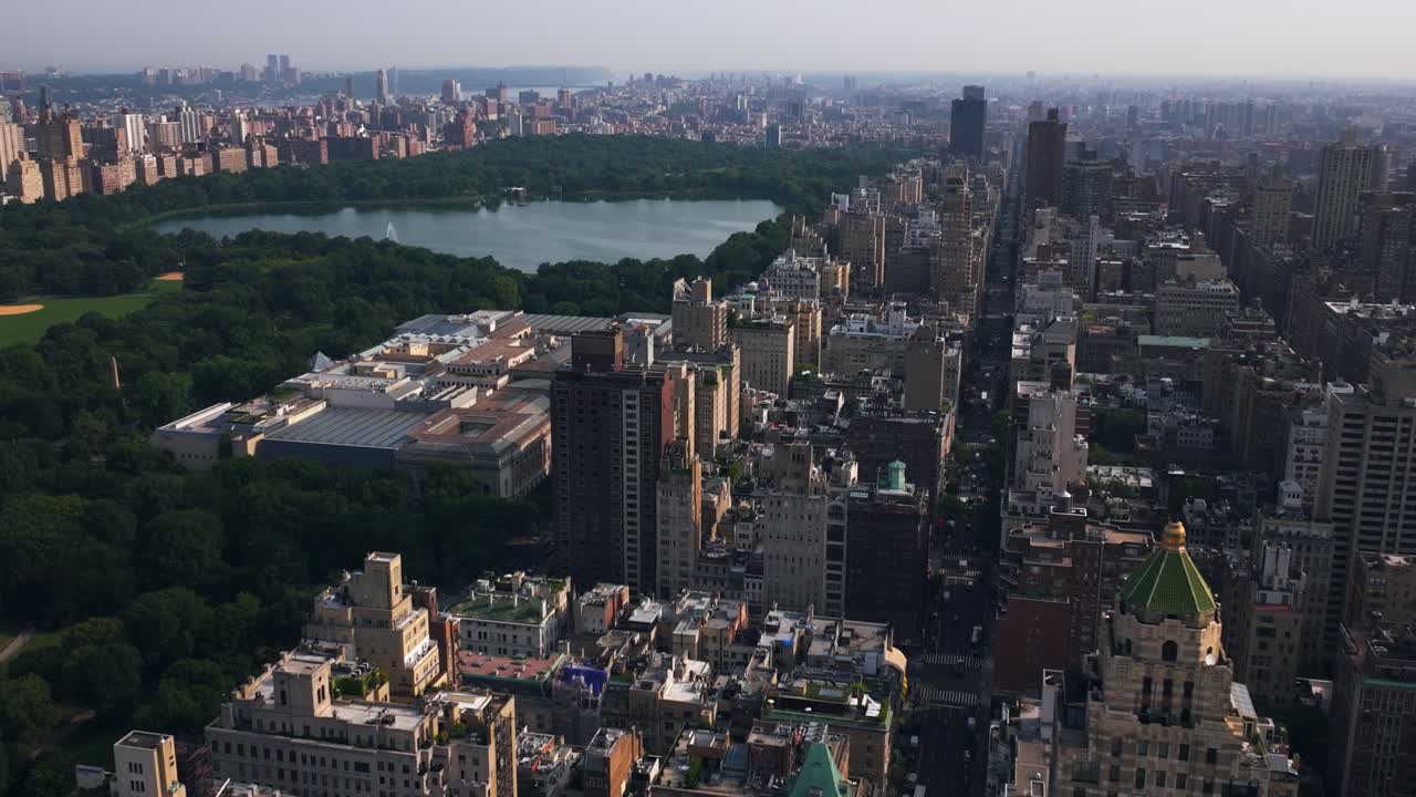 Drone rotating over the Lenox hill district and the Central park, sunset in NYC