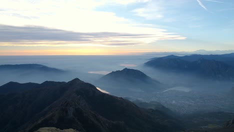 -Resegone-mountains-at-sunset-shrouded-in-fog-on-misty-day-over-Italian-Alps-in-northern-Italy