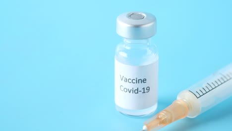 covid-19 vaccine and syringe