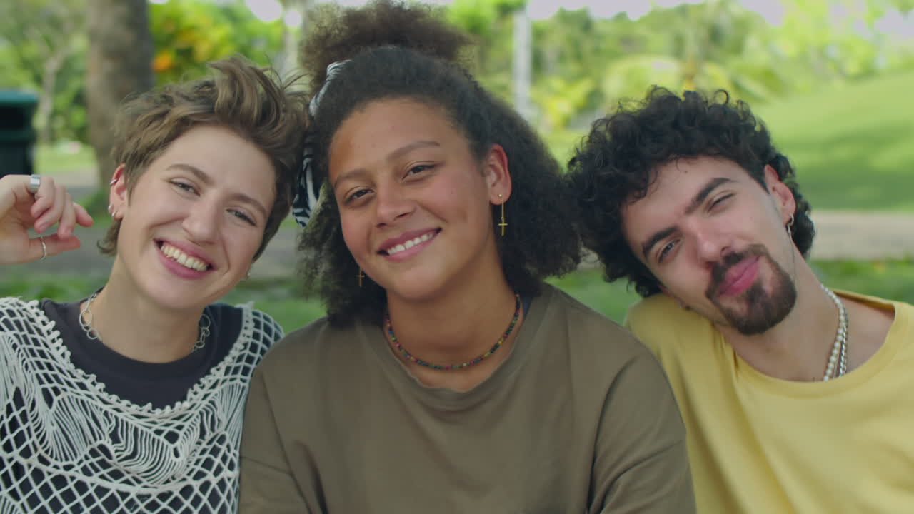 Portrait of Young Happy Friends in Park