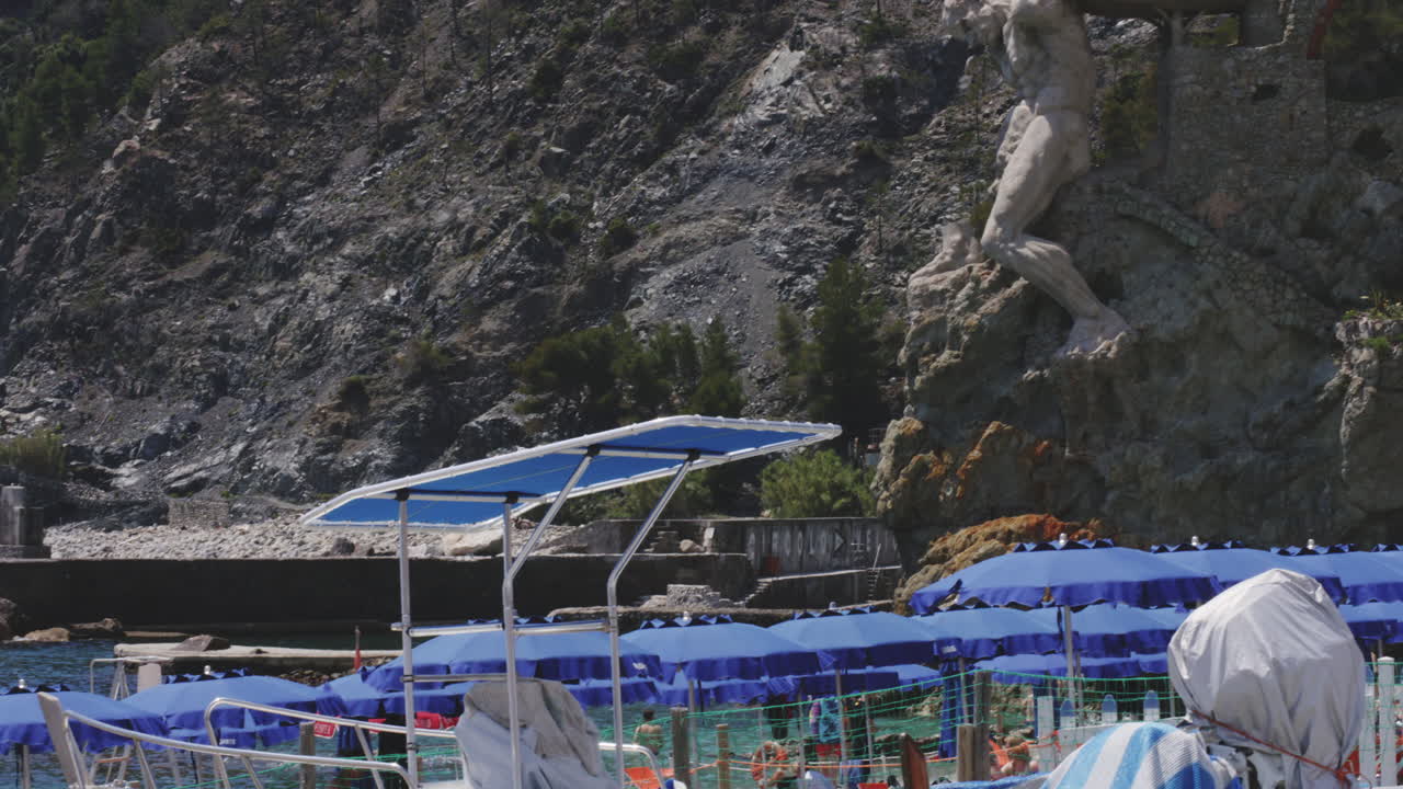 Tourists At Spiaggia di Fegina Beach In Monterosso, Cinque Terre Region, Province of La Spezia, Italy.