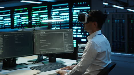 it worker doing maintenance on server farm gear using virtual reality technology