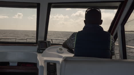 Timelapse-of-a-captain-steering-a-yacht