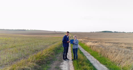 young farmers discussing at maize field agriculture 25