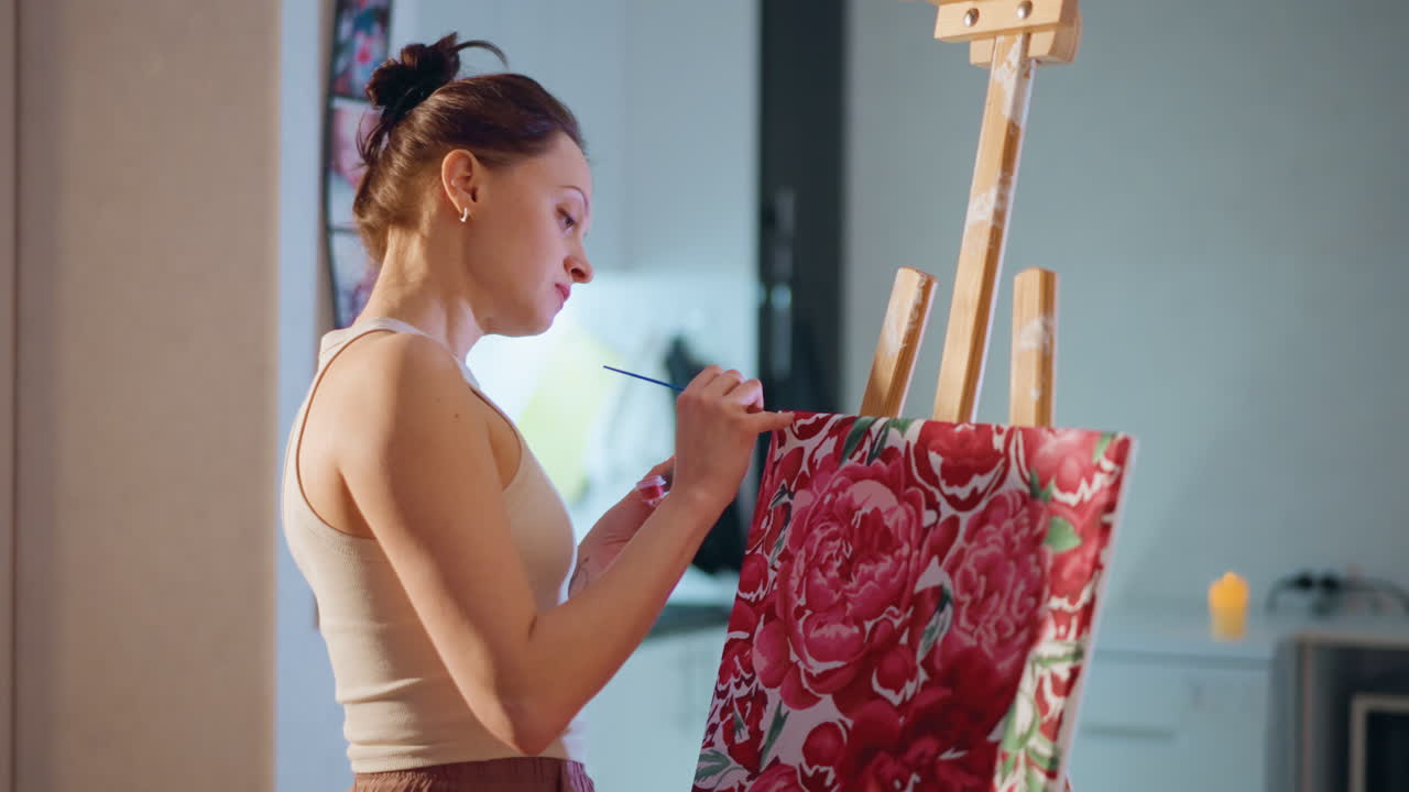 Female Artist Painting, Young Woman Focusing On Portrait, Bright Interior With Woman Crafting Detailed Artwork, Young Woman Carefully Creating Portrait With Precise Brush Techniques