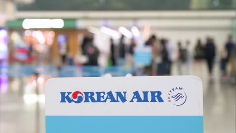korean air sign at an airport