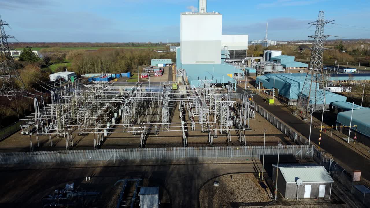 Detailed drone flyover of the King’s Lynn CCGT facility, showing the interplay between energy generation systems and overhead power lines