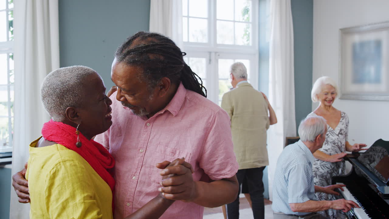 Group Of Seniors Enjoying Dancing Club Together