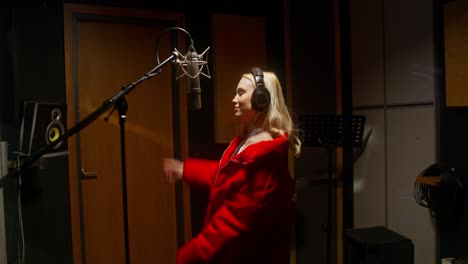 woman singing in recording studio