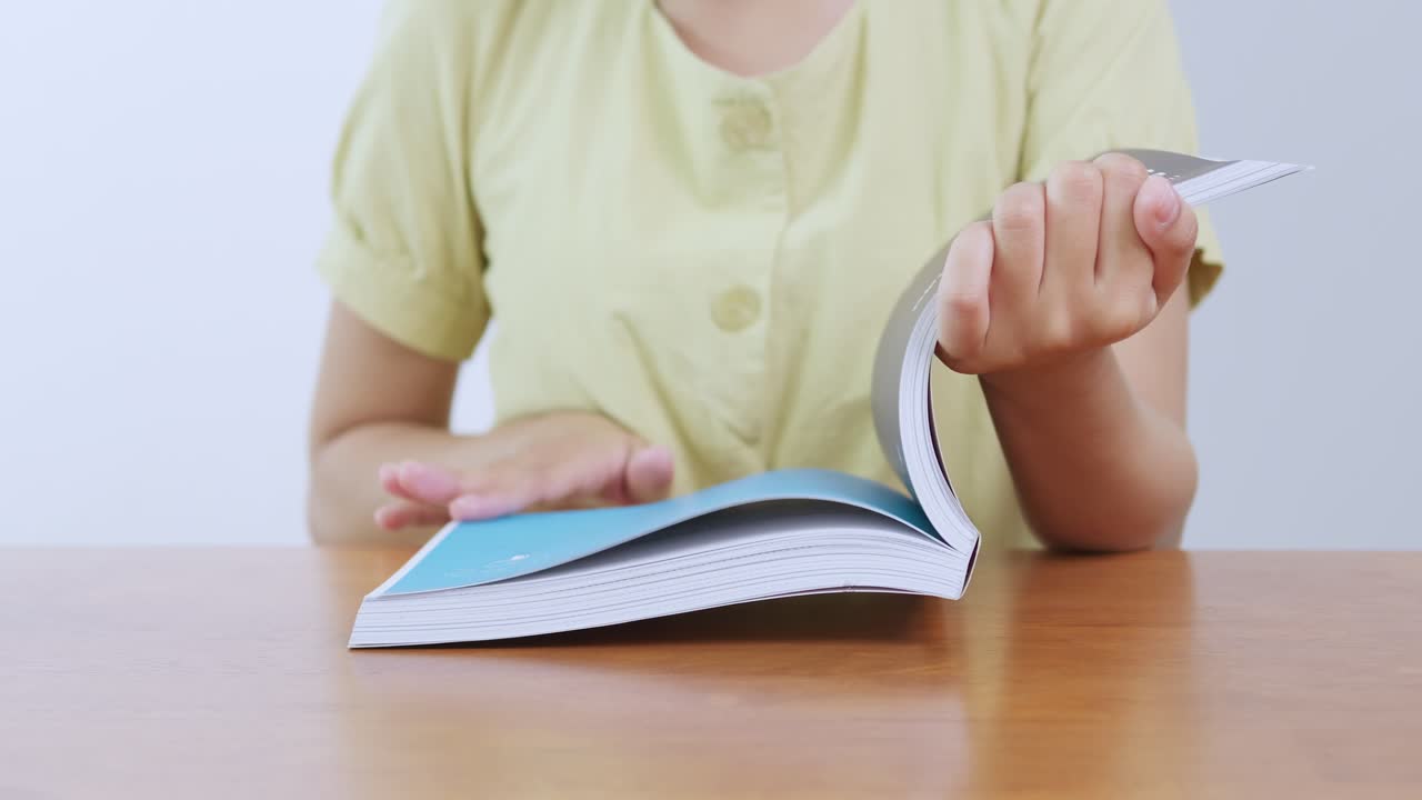 A person enjoys reading a book a cozy home environment highlighting the joy of literature