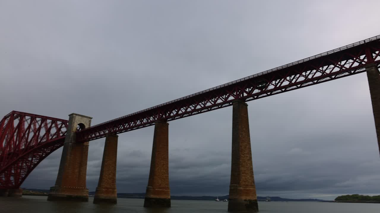 slow establishing shot of the train tracks running over the Queensferry bridge