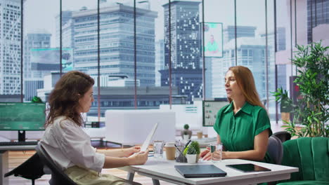 human resources manager conducts interview with job seeker in modern office