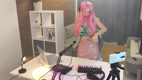 woman singing and streaming music in home studio