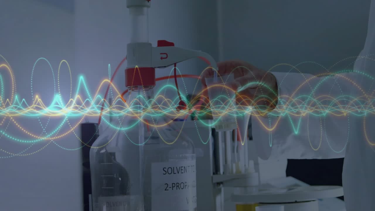 Researcher's hands gripping tubing in lab with animated waves monitoring flow for testing