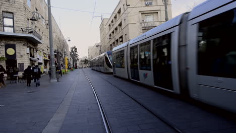 light rail passing by jaffa street, jerusalem. electric tran, clean transportation trolley in israel