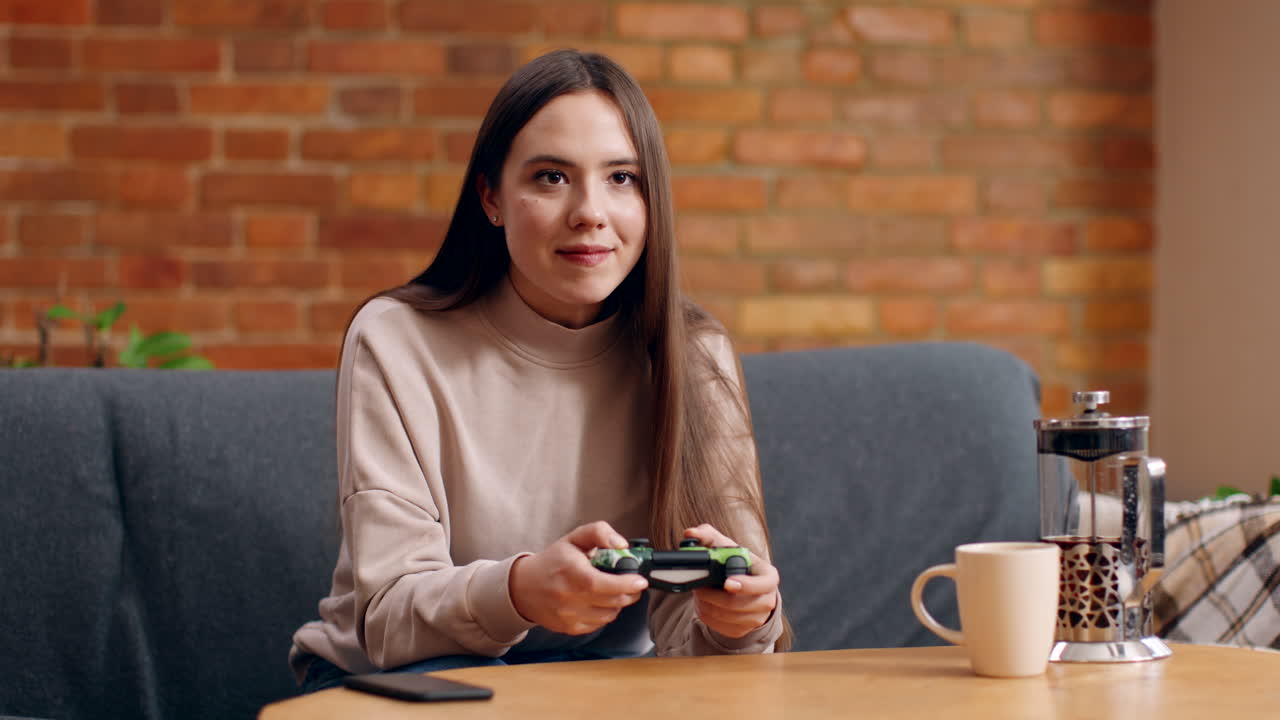 Woman Playing Video Games at Home