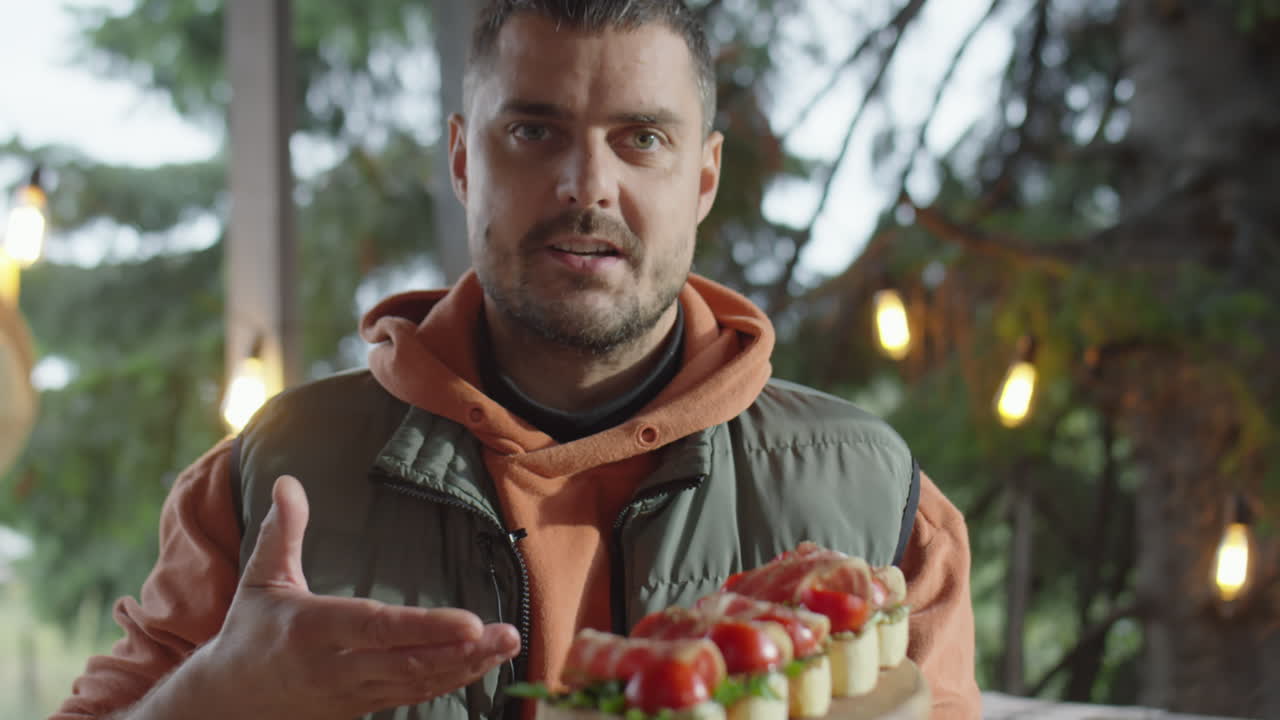 Food Blogger Holding Bruschettas and Talking on Camera