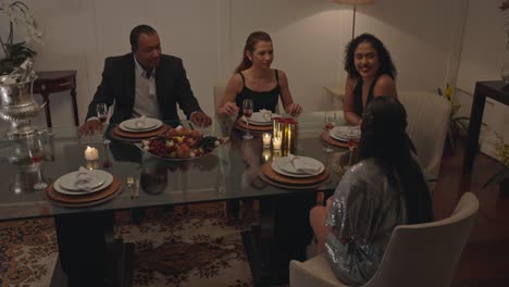 friends and family enjoying a festive dinner party