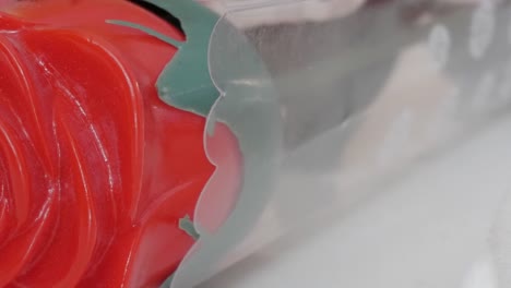 red rose-shaped candy wrapped in plastic, perfect for valentine's day gifting