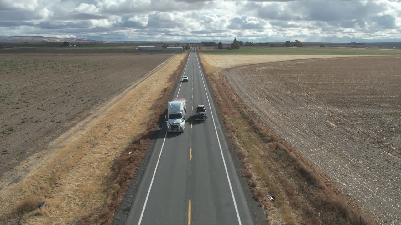 A follow shot from behind of a truck along the interstate