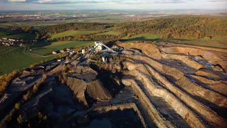 aerial view of open pit mining quarry during autumn in bohucovice, czech republic