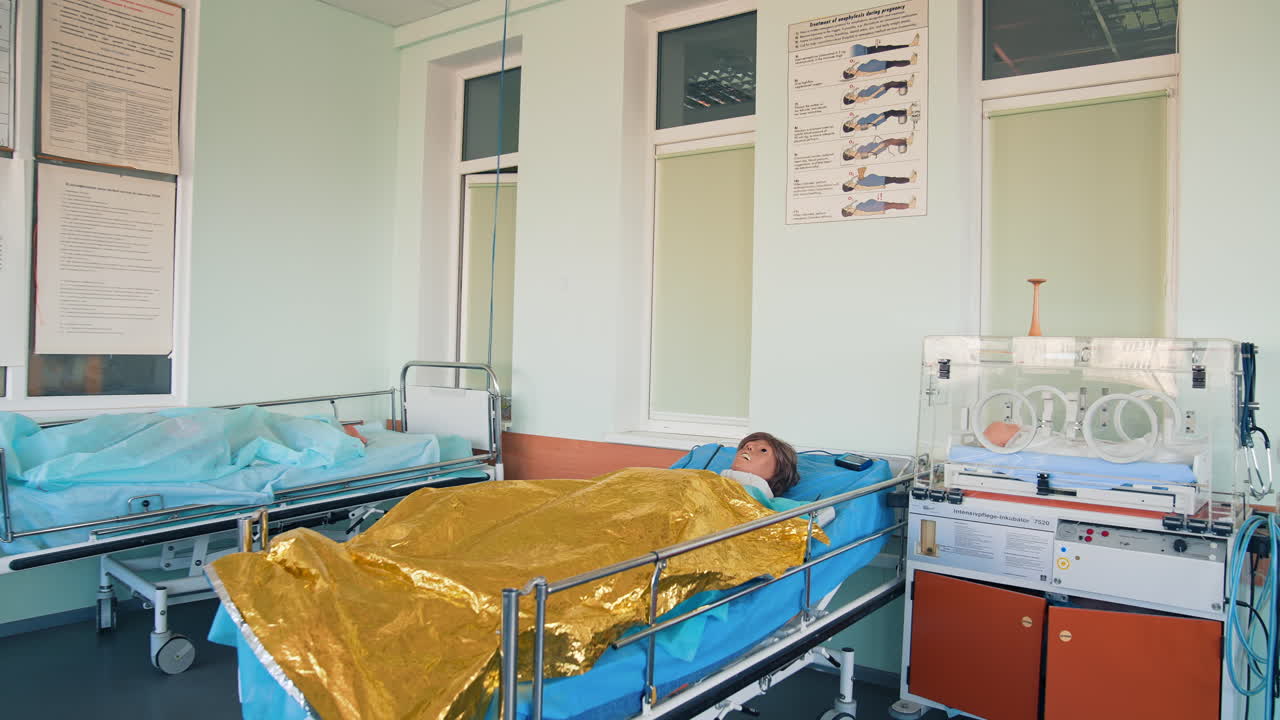 Medical mannequin on bed. Practicing with medical simulation mannequin in hospital