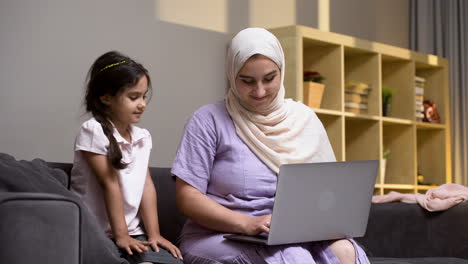 mother and daughter in the living room at home