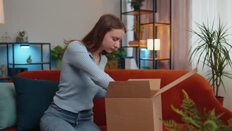 Angry-dissatisfied-shopper-shopaholic-woman-unpacking-parcel-feeling-upset,-confused,-wrong-delivery