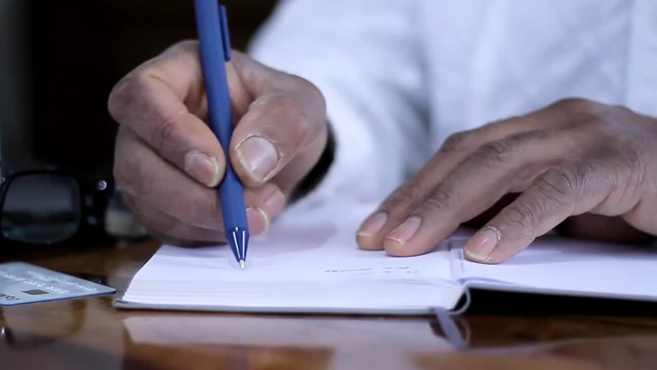 writing a letter with intention to purchase with a credit card stock video stock footage