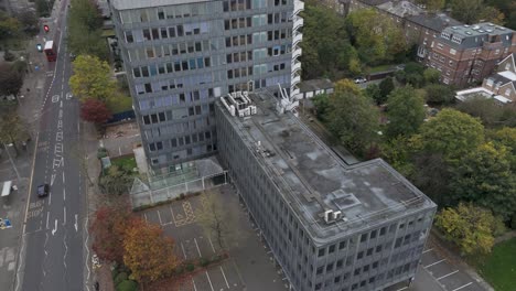 aerial view capturing deteriorating brutalist office complex awaiting renovation, showcasing concrete architecture and urban development potential in ealing, london, uk, october 2024