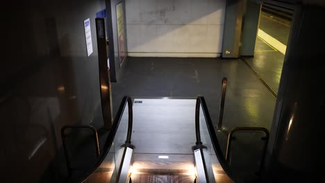 deserted escalator in a subway station