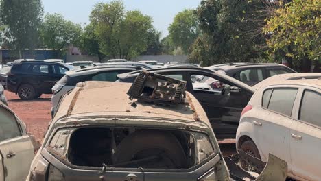 tracking shot of an accidental and damaged car yard